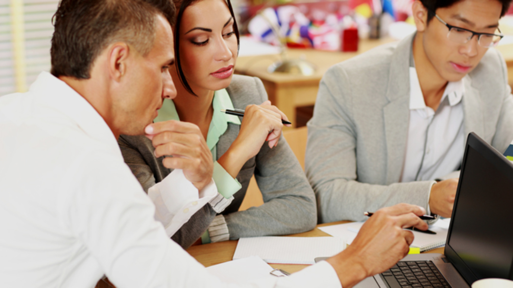 Business people working around table in office